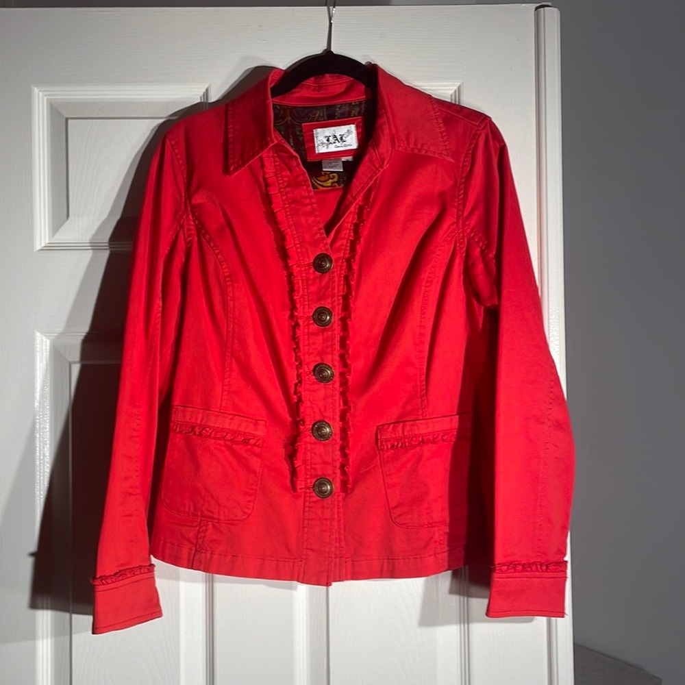 Red 100% cotton fitted jacket with ruffles and 5 quarter sized is a medium